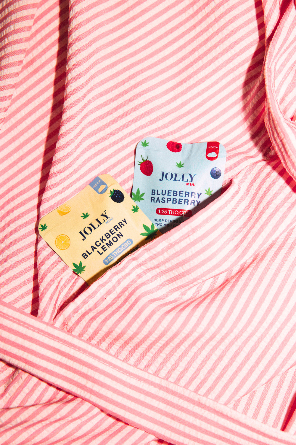 JOLLY CANNABIS THC CBD 1:1 GUMMIES IN EVERY FLAVOR ON A TABLE DURING THE SUMMER