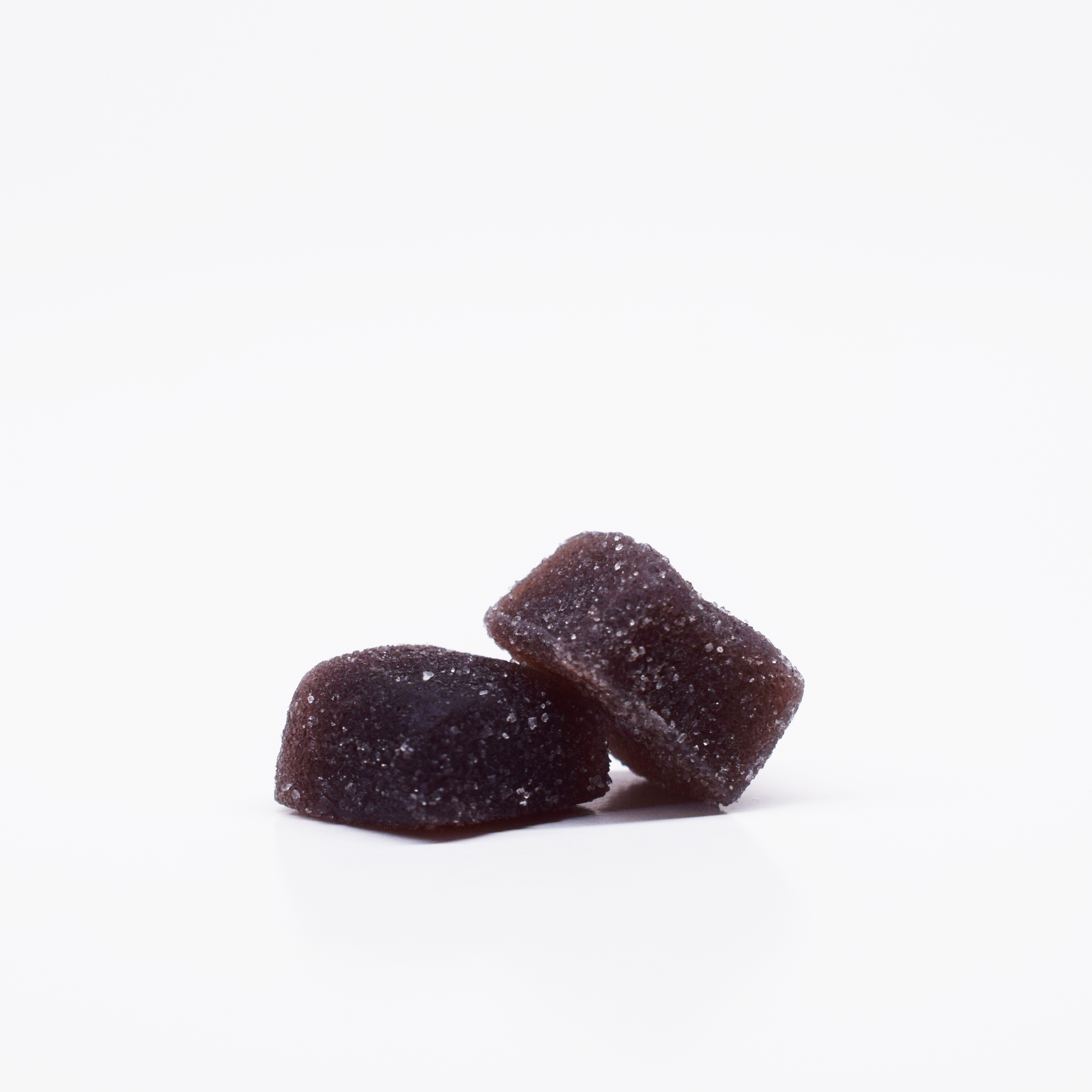 JOLLY 1:1 THC:CBD Cherry Blackberry Gummies. Dark purple, square, sugar coated gummies